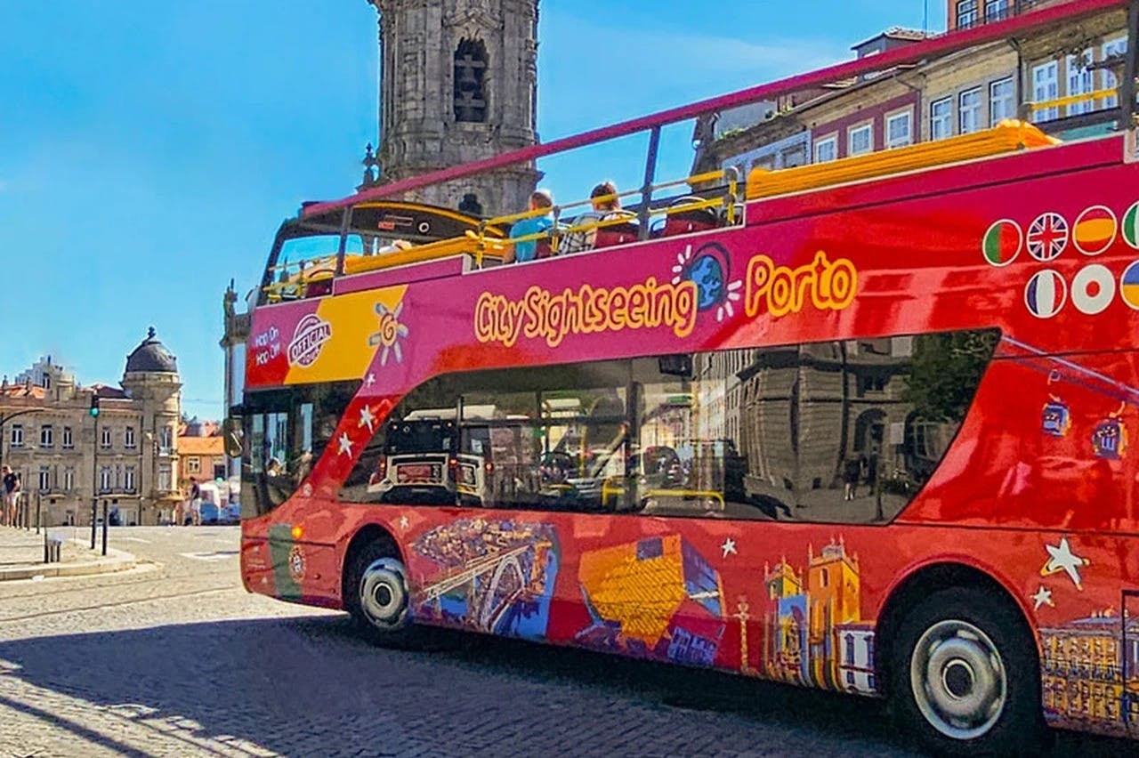 Red hop-on hop-off sightseeing bus in Porto